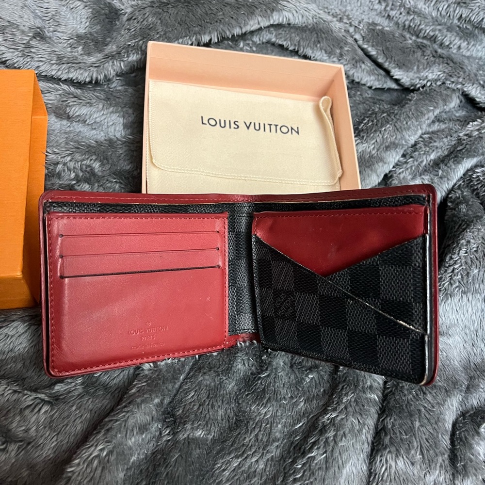Louis Vuitton wallet. Limited edition red inside black outside
